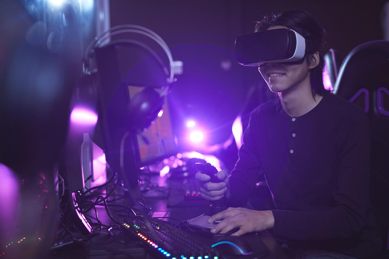 side view portrait young asian man wearing vr headset while playing video games using racing shift dark cyber interior copy space 1 4 Things That Kill Your Chances For Music Career Success